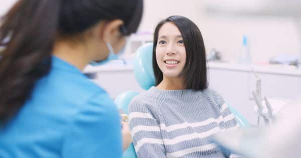 dentist talking to a patient